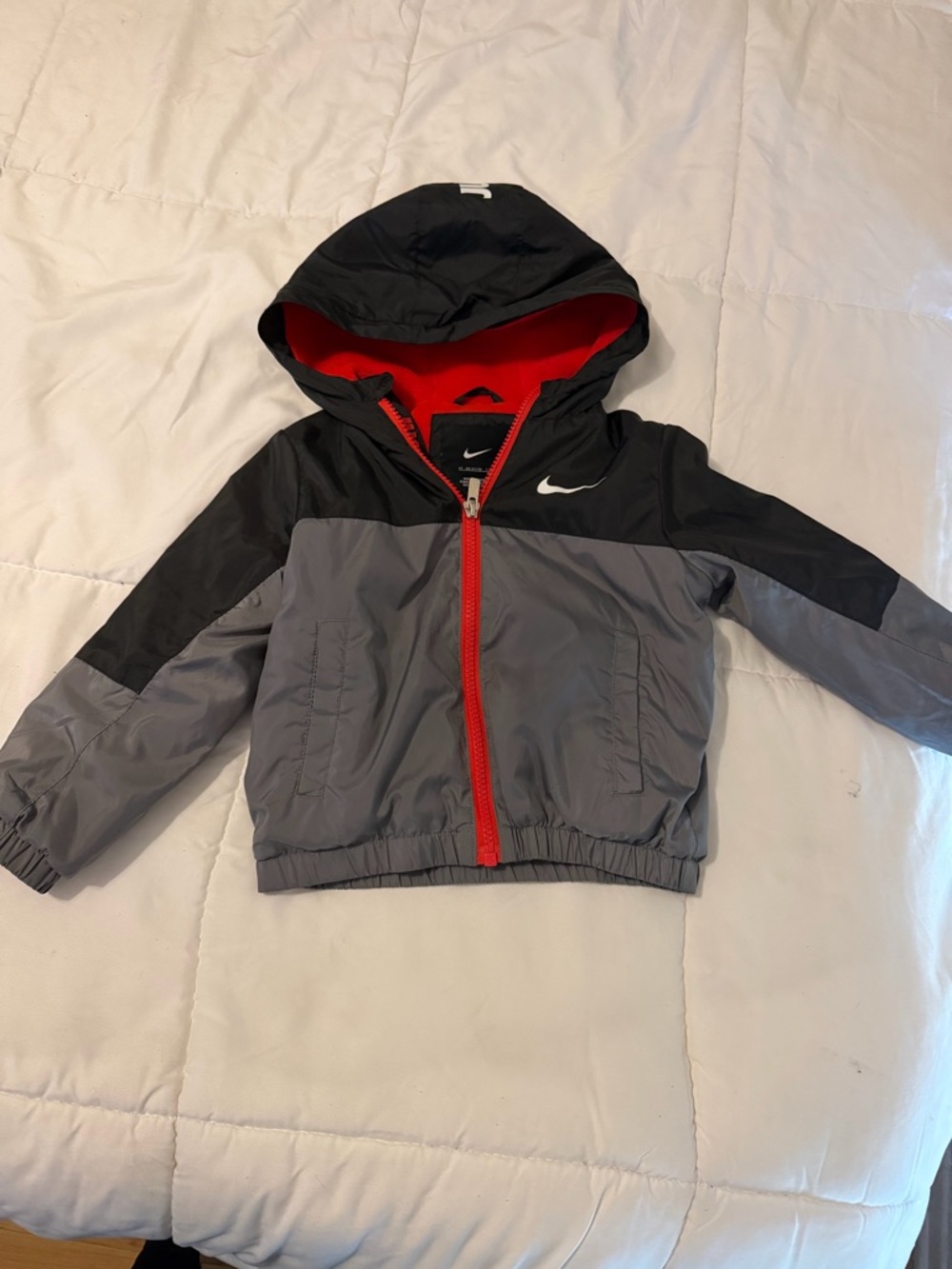 Nike Kids Hooded Colorblock Rain Jacket in Gray/Black with Red Accents